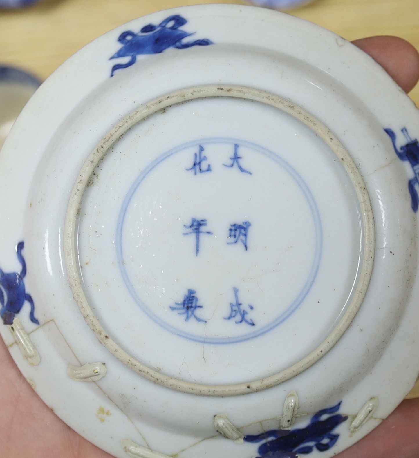 A group of 19th century blue and white pottery to include a chinoiserie pattern meat plate, 53.5 cm, a patent ironstone pheasant pattern dish, 47.5 cm, various tureens, dishes, ladles etc. a pearlware jug and two Chinese